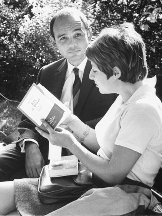 Cuban Author Severo Sarduy Showing His Book to a Student