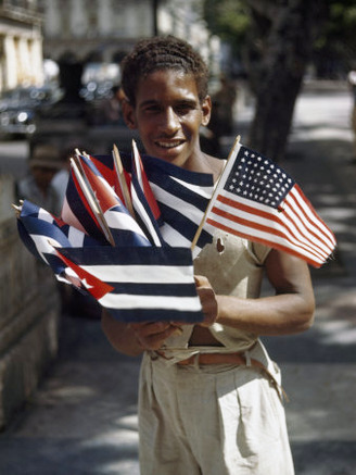 Teenage Boy Sells Cuban and American Flags