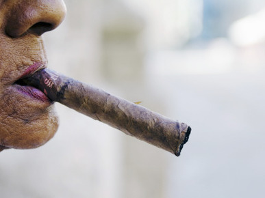 Profile of Cuban Woman Smoking Cigar in Vieja District